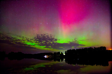 beautiful northern lights in the lake box on a clear autumn night