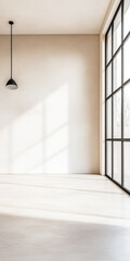 Obraz premium Empty room interiors in warm tones with a mix of natural window lighting and shadows. Minimalist apartment interior