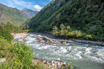 View of Langtang Khola river a river coming from the south flows down along the Langtang trekking route, Nepal.  © boyloso