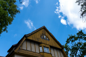 An old wooden roof on a historic building, weathered by time, adds charm to the architectural heritage