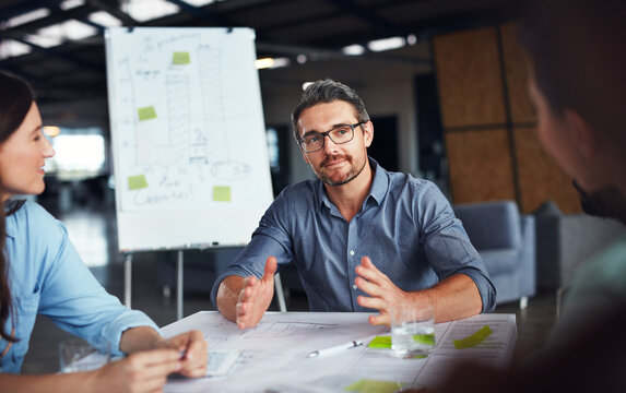 Business, people and boss in boardroom on meeting for planning, brainstorming and strategy. Office, employees and discussion with whiteboard for presentation, feedback and report on company growth