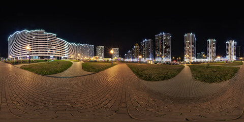 night panorama 360 near skyscraper multistory buildings with illumination of residential quarter...