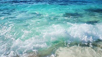 Clear blue turquoise water with frothy waves and intricate water textures