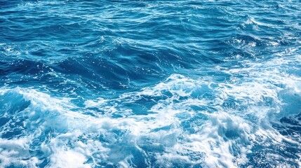 Fototapeta premium Pure blue turquoise water texture of the ocean sea with foam from and waves