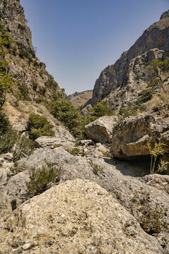 empty bed of a river that flows through a topolia gorge on the crete