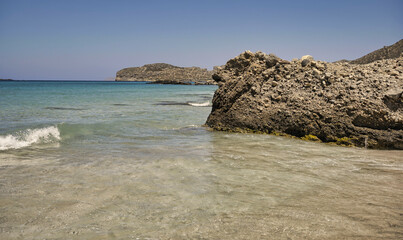 Landscape with waves hitting rocky coast of Mediterranean Sea