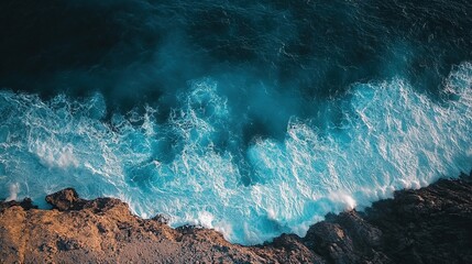 Drone shot for aerial filming over a coastal cliff, turquoise ocean waves crashing below, dramatic light, cinematic