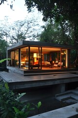 Obraz premium Modern Concrete House With Large Windows And Wooden Deck