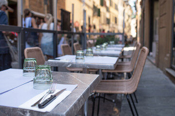 Terrace with tables prepared for eating in Florence, Tuscany