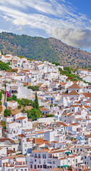 Fototapeta premium Outdoor, buildings and village in nature, mountain and architecture of homes, sky and neighbourhood. Cliff, travel and peace of countryside, property and history of real estate, scenery and Spain