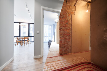 Living room and bedroom with large windows and doors before and after refurbishment or restoration....