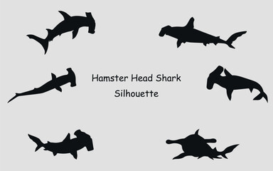 Obraz premium Black silhouettes of a hammerhead shark. Vector on a gray background