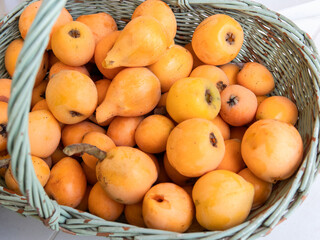 Fresh ripe loquats in basket