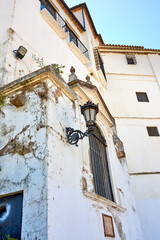 Heritage, whitewash and broken house for architecture, buildings or travel in Spain. Ronda, old city and village design with history for exploration, culture and cracked stone in Europe for aesthetic