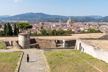 Naklejka premium Young woman strolling through the Forte di Belvedere. Florence, Tuscany.