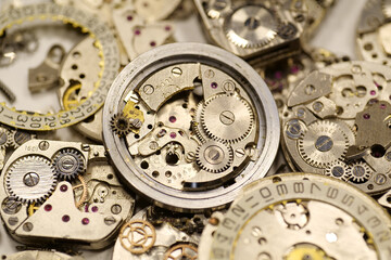 Old mechanical watches with gears and cogs. Watch or clock mechanisms