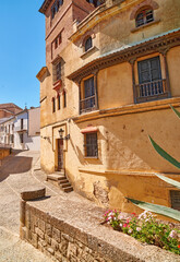 Building, ancient and outdoor location on vacation, Europe summer and historical culture on getaway. Travel, vintage and traditional village in destination, architecture and urban holiday in Ronda