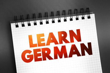 Fototapeta premium Learn German text quote on notepad, concept background