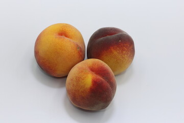 ripe peaches isolated on white