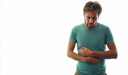 Young man experiencing stomach pain, holding his belly in discomfort