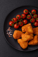 Breaded camembert or brie cheese baked in the form of nuggets with salt and spices
