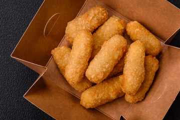 Fast food breaded cheese sticks with salt and spices