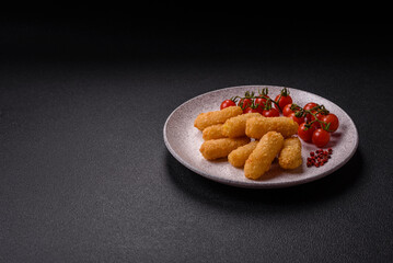 Fast food breaded cheese sticks with salt and spices