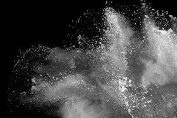 White powder explosion on black background. Colored cloud. Colorful dust explode. Paint Holi.