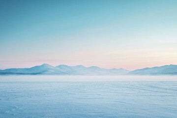 A serene snow-covered landscape with a gradient sky transitioning from a pale blue at the horizon to a deep indigo above. The snow-covered ground and distant mountains are bathed in the cool gradient