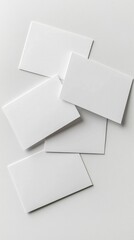 Spread of Blank White Rectangular Postcards Against Plain Background