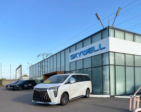 Facade of Skywell car store. Skywell New Energy Automobile Group is one of the leading electric vehicle manufacturing companies in China. Skywell logo. Chinese car.