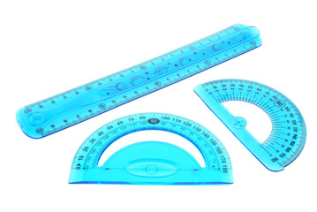 flexible, bendable, ruler and drawing protractor, blue triangle, transparent, on white background, close-up, macro photography