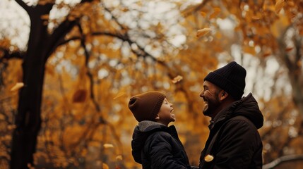 A joyful moment captured between a father and his son surrounded by vibrant autumn foliage, their smiles reflecting the warmth of the season.