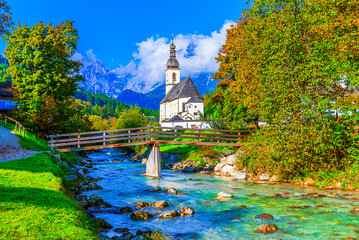 Ramsau, Berchtesgaden National Park, Germany: Autumnal scenery with Parish Church of St. Sebastian and River Ramsauer Ache, Bavaria