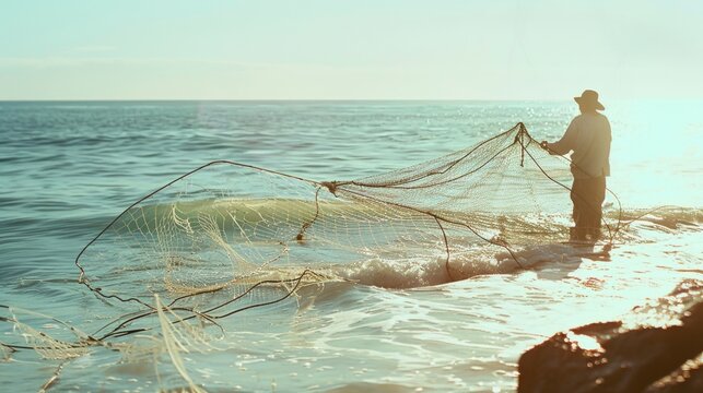 A lone fisherman standing on the shore, casting a net into the ocean under the golden sunlight, capturing the serenity of coastal life.