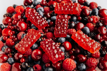 Natural berry marmalade on fresh fruit and berries, perfect for advertising healthy sweet treats