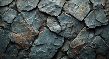 Textured gray rocks with natural patterns and hues in a rugged formation