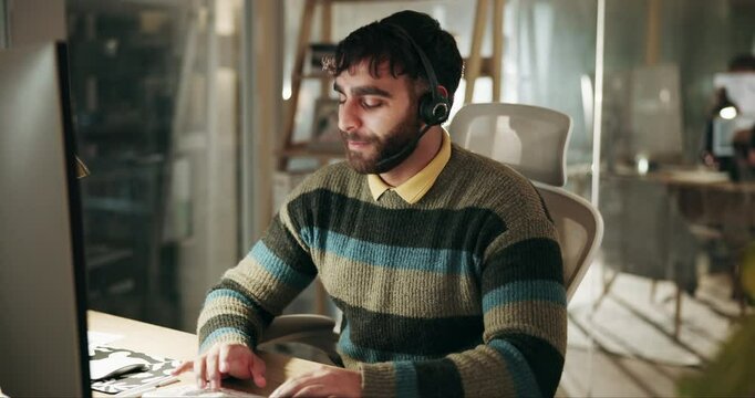 Call center, night and man consultant with computer in office with international customer service for crm. Talk, headset and technical support agent with client for troubleshooting software system.