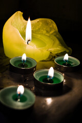 light green candles burning ritual offering to goddess saraswati indian culture diwali holiday wisdom knowledge wealth prosperity meditation spirituality and rituals religious services selling candles