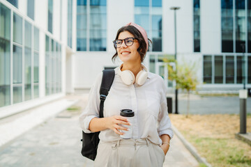 Fototapeta premium Young caucasian women student going to university at university campus