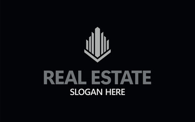 A sleek and modern logo design ideal for real estate businesses, featuring a silver skyscraper icon symbolizing urban development and construction