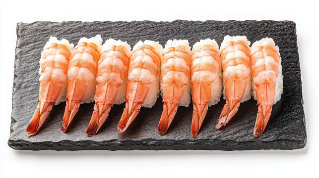 A close-up shot of eight pieces of ebi nigiri sushi, a popular Japanese dish, arranged neatly on a black slate plate against a white background.