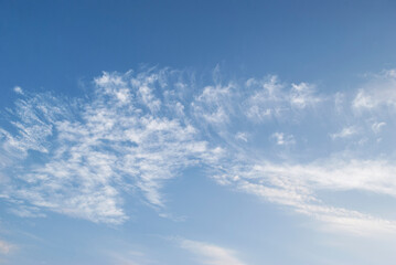 gentle white clouds in the blue sky