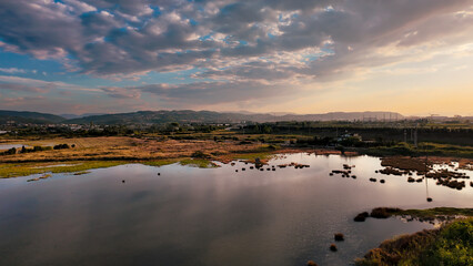 Stunning Aerial View of Lake and Forest on a Cloudy Day. View of the lake from the bird observation tower. A perfect lagoon.