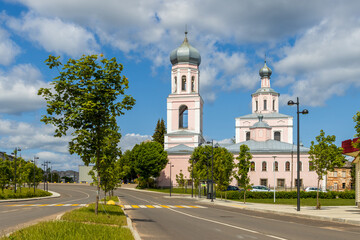 Trinity Cathedral, Valday town (Valdai), Novgorod region, Russia. Popular tourist architectural landmark of Valday. View of the bell tower and the Orthodox Church. Street in a small provincial town.