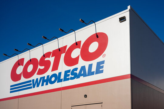 Aloha, OR, USA - Jan 25, 2022: Costco sign is seen at one of its warehouse stores in Oregon. Costco Wholesale Corporation operates a chain of membership-only big-box warehouse club retail stores.