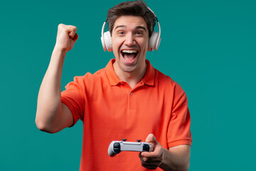 Fototapeta premium Mature 30s man playing online video game on console TV with joystick. e-sport