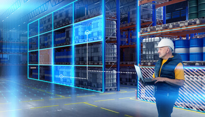 Warehouse logistics. Man standing inside storage hangar. Logistics center manager with laptop. Man monitors occupancy of warehouse through computer. Storage technologies. Manage warehouse