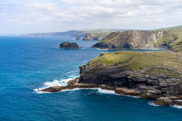 View from Tintagel Castle: Cliffs, Beach, and Sea with Blue Water and Golden Sand