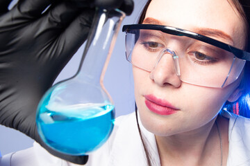 Laboratory technician with test tube. Woman scientist. Laboratory technician portrait. Girl in...